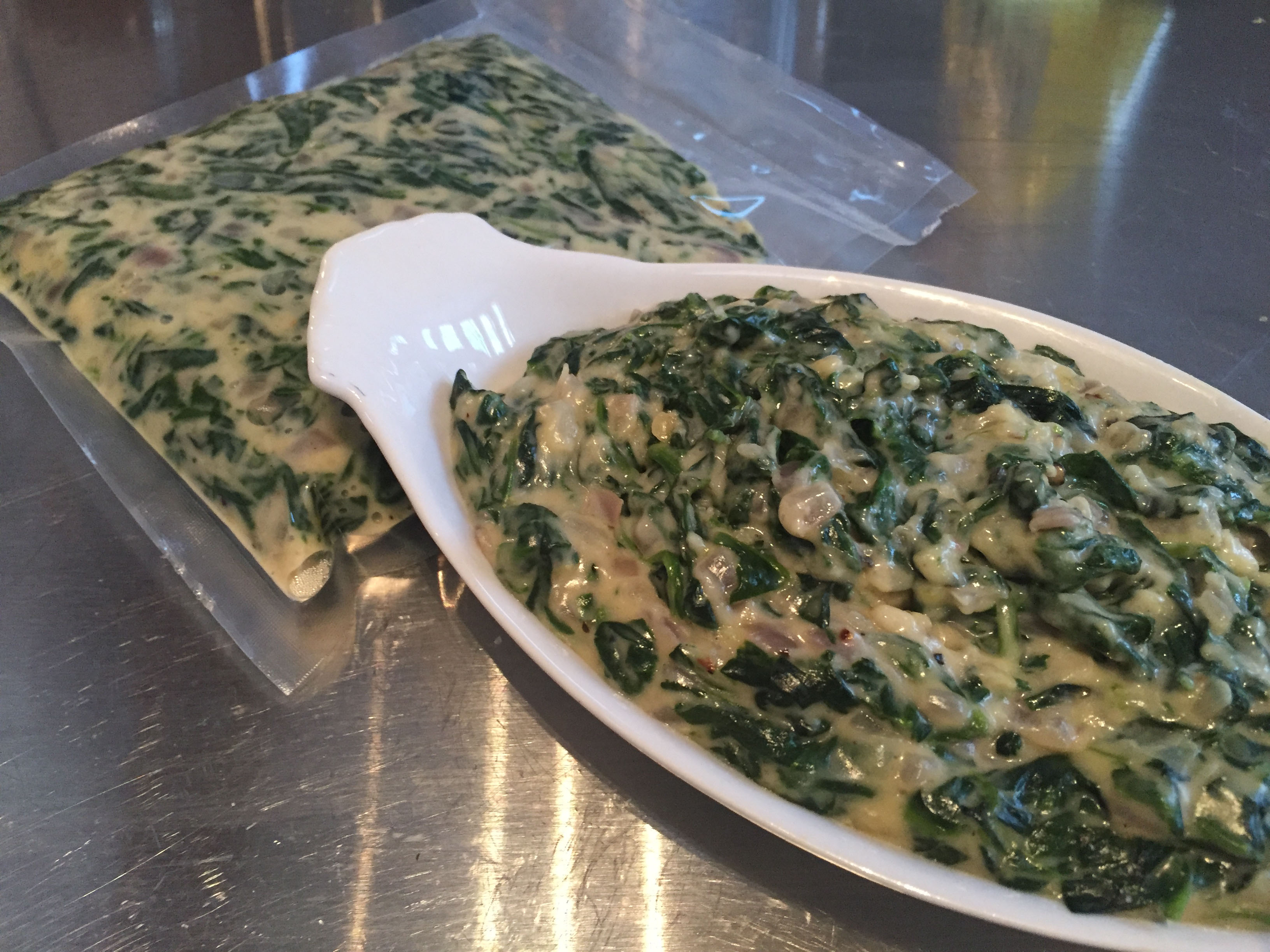 Creamed spinach vacuum sealed and served