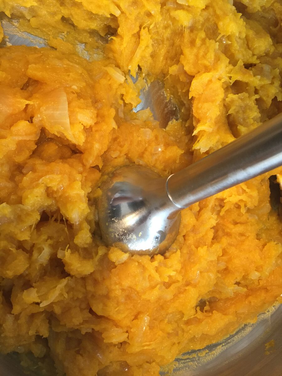 mixing pumpkin and onions for pumpkin soup