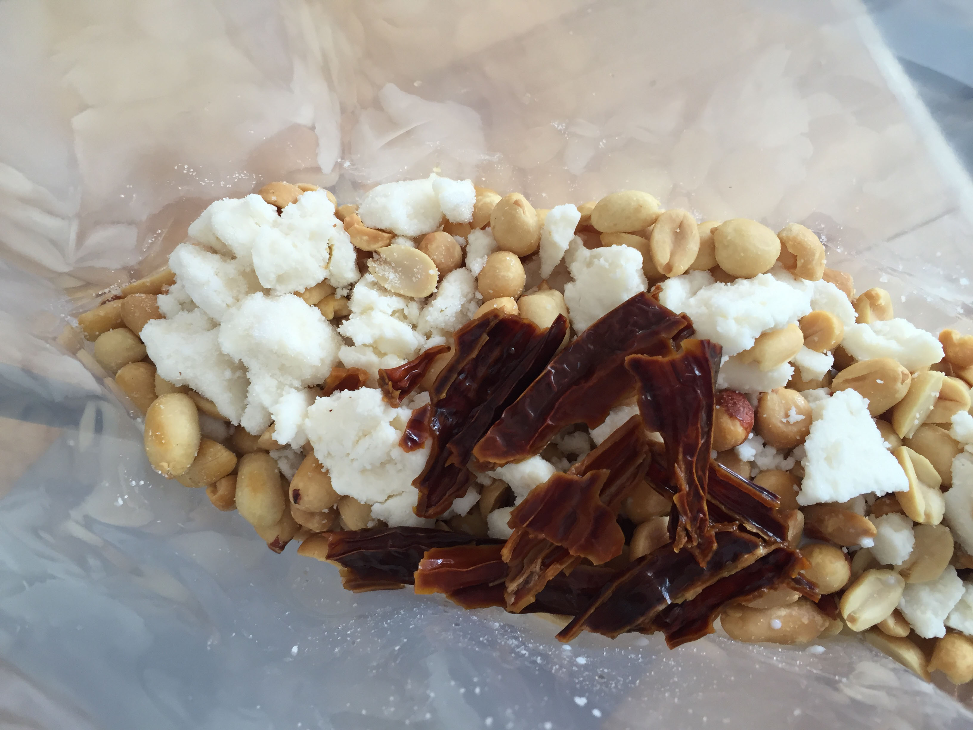 spicy peanut and cheese sauce ingredients in vacuum bag