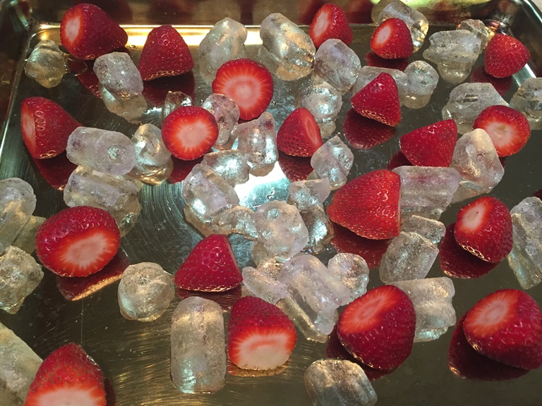 Strawberries sprinkled with ice for Flash Freezing